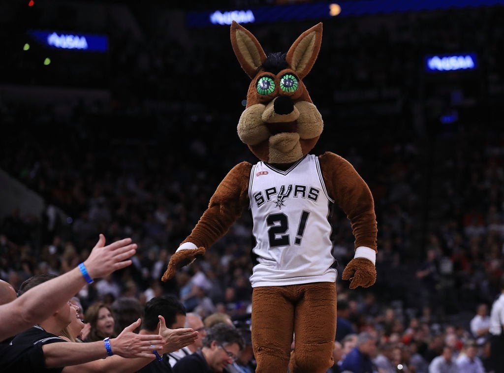 The Spurs Mascot Catches a Live Bat, While Wearing a Batman Costume