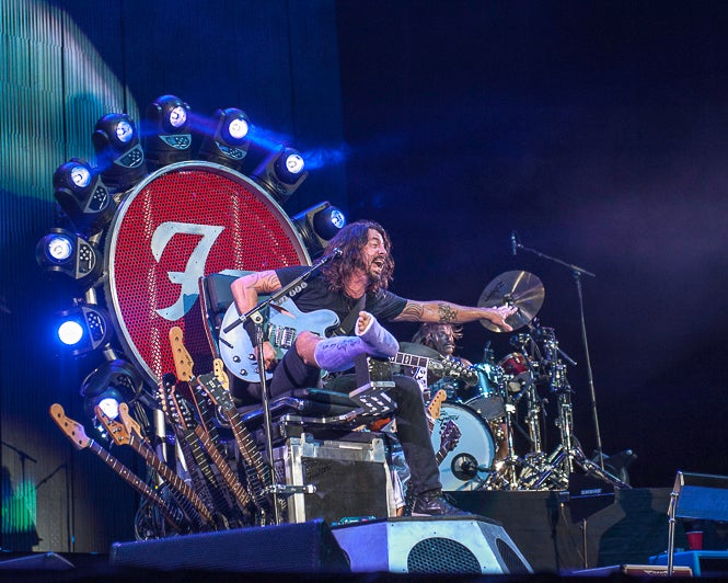 Dave Grohl on his Foo Fighters throne, which he needed when he had a fractured leg.